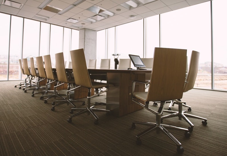 empty meeting room | "Leadership Tools for Success" by Dr Carlos Garcia | Anxiety & Depression Counseling Blog | Tampa Counseling and Wellness | 2 Locations: Land O' Lakes, FL 34638 & Tampa, FL 33618